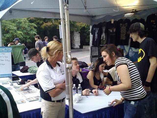 0905091636.jpg - Sick Puppies signing autographs after their set